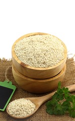 Healthy food - fresh white sesame seed in wooden bowl