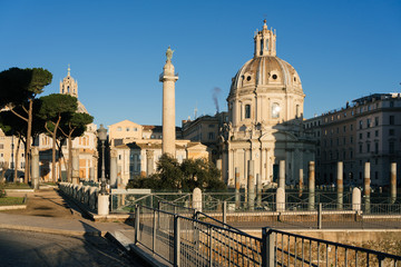 Fototapeta na wymiar Rome, Italy - Dec 31, 2019: Trajan's Column (UNESCO World Heritage Site) in Trajan's Forum and church of Santa Maria di Loreto, Rome, Lazio, Italy