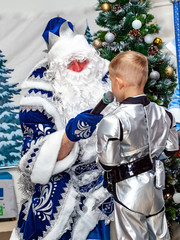 boy in astronaut costume at Christmas celebration
