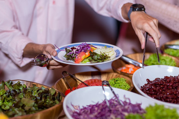 Food Buffet Catering Dining Eating Party Sharing Concept.people group catering buffet food indoor in luxury restaurant with meat colorful fruits and vegetables
