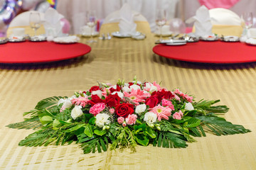 The flowers are beautifully arranged on the table.