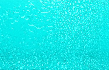 Drops of water on a color background. Selective focus. Blue