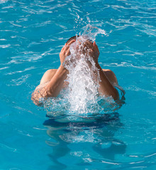 man resting by the pool on a summer day