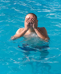 man resting by the pool on a summer day