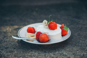 ice cream dessert with fruit close-up. Advertising concept of desserts, sweets, cooking, holidays