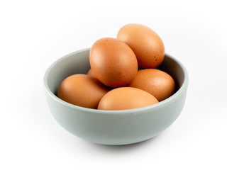Put eggs in one bowl on white background