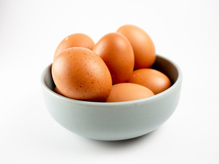 Put eggs in one bowl on white background