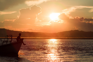 Naklejka na ściany i meble Sunset at the Irrawaddy River (Ayeyarwaddy River) in Bagan, Myanmar (Burma)