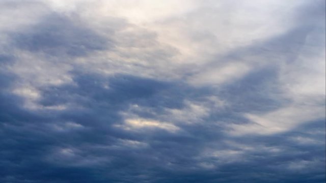 time lapse of flying clouds a bright sun and blue clouds before the rain. 4 K.