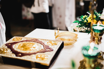 Golden crowns lying on the table in church