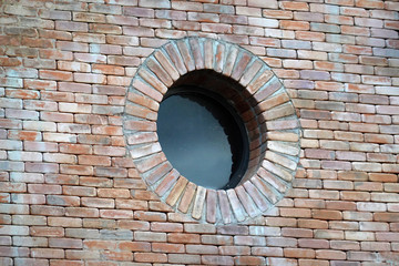 Brick red wall texture and window round shape      