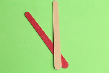 Nail file on colorful background