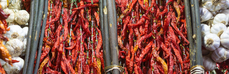 Dried red pepperoni on the market