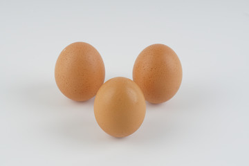 Three eggs on white background.