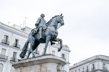 Fototapeta na wymiar Madrid, Spain - Plaza Mayor of Madrid with the King Phillip III statue on a horse