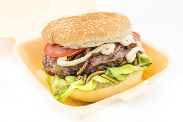 Burger of endible worms  with tomato and lettuce
