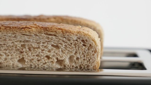 Double bread electric toaster slots close-up 4K video