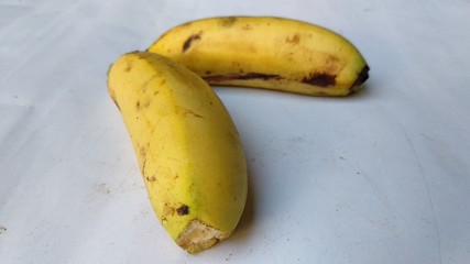 banana which is yellow and still fresh on a white background