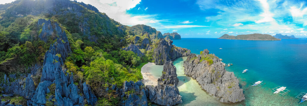 Aerial view of Hidden beach in Matinloc Island, El Nido, Palawan, Philippines - Tour C route - Paradise lagoon and beach in tropical scenery