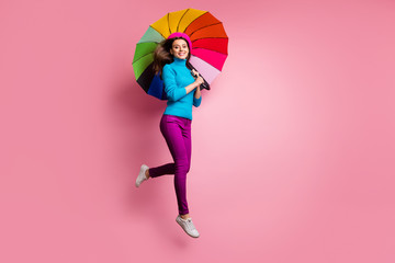Full size photo of cheerful girl jump hold shine umbrella enjoy fall free time weekends feel...