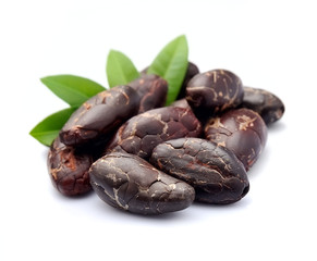 Cocoa beans with leaves .