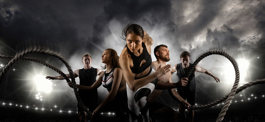 Sport collage. Men and woman running on smoke background - obrazy, fototapety, plakaty