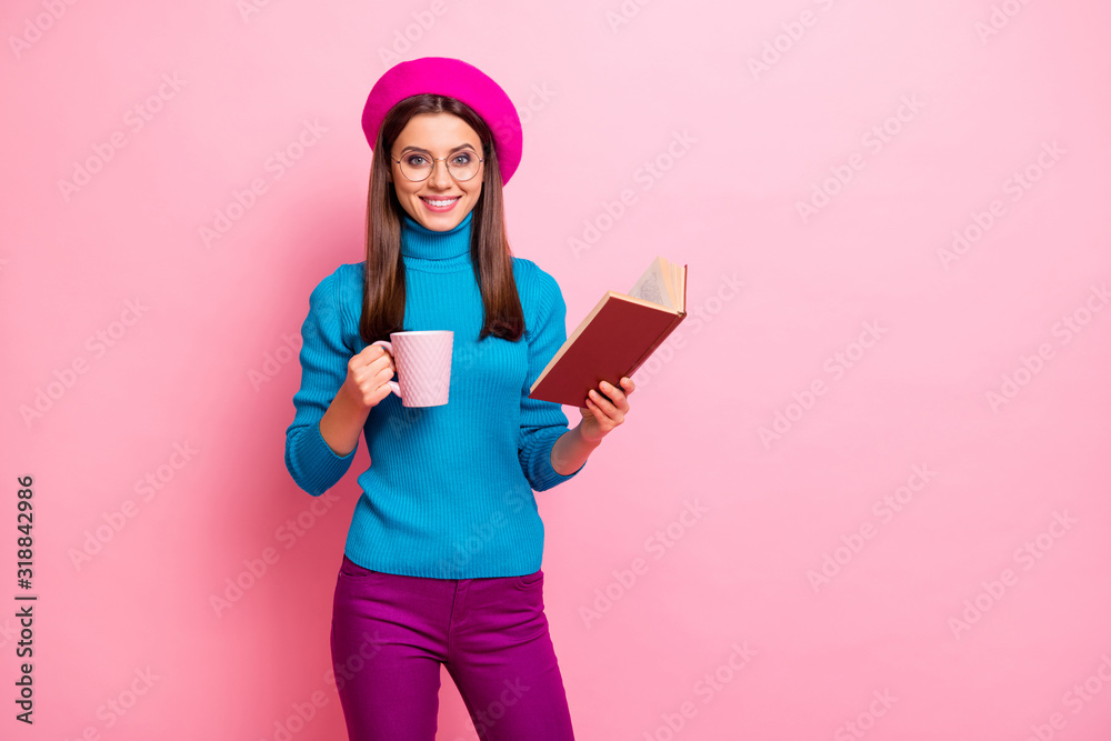 Poster portrait of positive girlish girl hipster student abroad hold paper book hot cappuccino coffee cup e