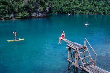 Sugba lagoon, tourists attraction. SUP Stand up paddle board. Blue sea lagoon, National Park, Siargao Island, Philippines.