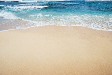 Fototapeta na wymiar Textured background. Sand and water. Tropical beach.