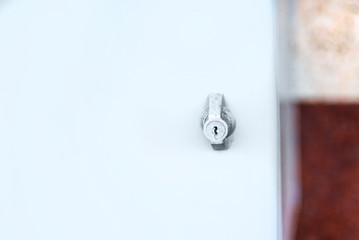 Obraz na płótnie Canvas Key in security metal keyhole close up