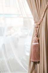 Curtains and tulle in a modern interior. Various decorative fabric materials for the home. Modern vision of style. The combination of colors and aromas. decoration of windows in the room