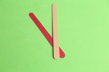 Nail file on colorful background