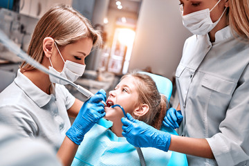 Young girl at dentist, dental treatment