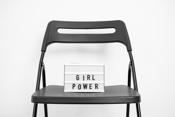 Girl power text on the lightbox. white background. Equality in gender rights. DEmocracy