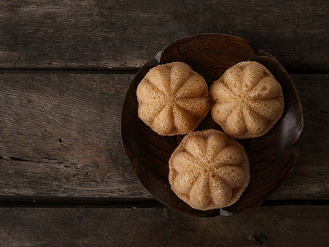 Simple styling flatlay photoshoot of baulu cakes in the form of star gooseberry. A malay called kuih bahulu.
