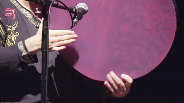 close-up of the artist performing the darbuka