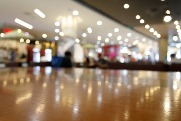 wooden table empty of display in cafe with luxury light decoration