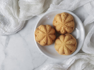 White photoshoot of baulu cakes in the form of star gooseberry. A malay people called kuih bahulu.