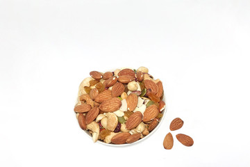 Many nuts in an almond cup are placed on the side.