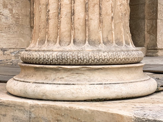 Base of a Greek stone column at the Parthenon of Acropolis in Athens, Greece. Detail of a temple...