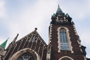 Olga and Elizabeth church in Lviv. Baroque and Gothic architecture. Steeples on the towers. Vaulted window on facade of the building. Lviv, Ukraine