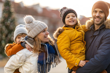 Affectionate young family enjoying their day in a city