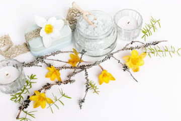 Frame made of branches and yellow spring flowers on white background. Beauty, spring, Easter concept. Flat lay, top view, mock up.