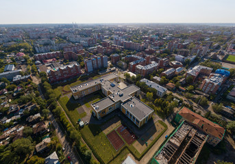 Fototapeta na wymiar School in Tomsk city. Aerial, summer, sunny
