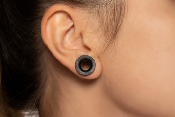 Female tunnel ear hole earring pierce