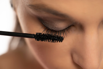 mascara applying on female natural eyelashes