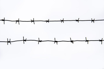 two barbed wire fence on white background. 