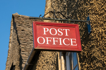 Post Office sign in rural location, England, United kingdom