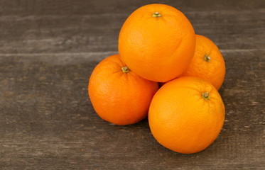 Orange benefits Concept. Orange Fruits on wooden background