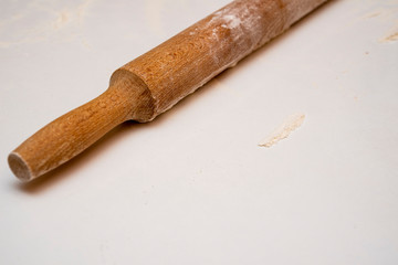 rolling pin on the table with flour
